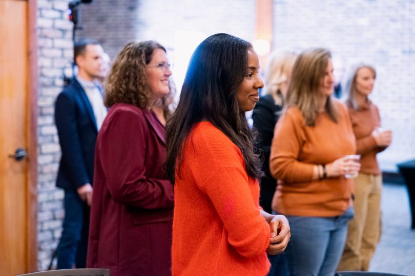 group of inspirant employees listening to a speech