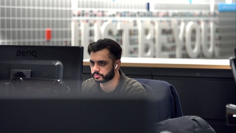 Justworks team member working on a computer in the office