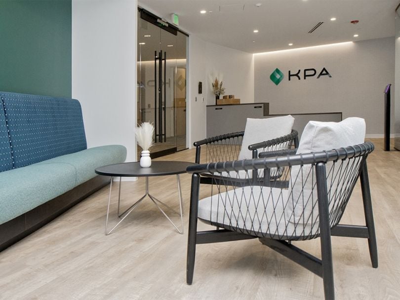 A photo of the reception area in the KPA office with a couch and chairs.