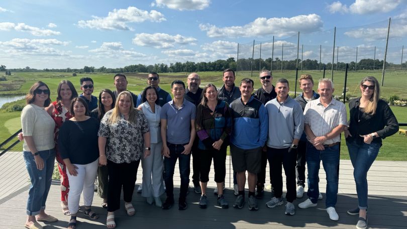 A group of Lob employees standing on grass