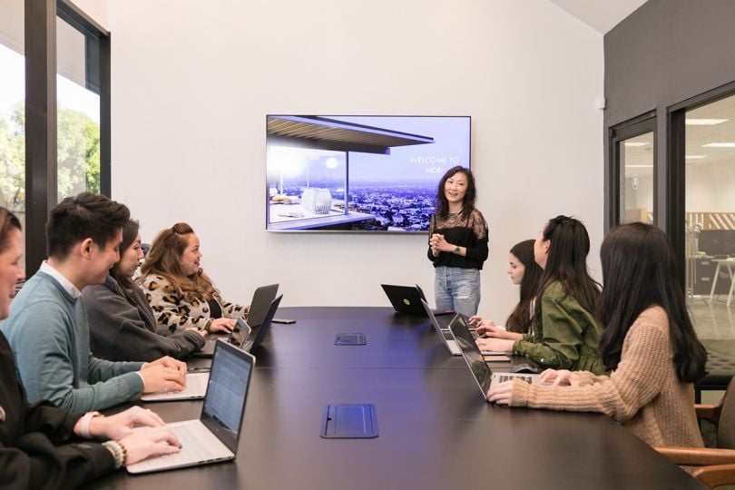 Million Dollar Baby Co. colleagues having a meeting