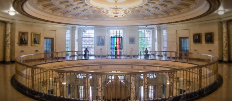 The rotunda at the office with a pride flag hanging in the window