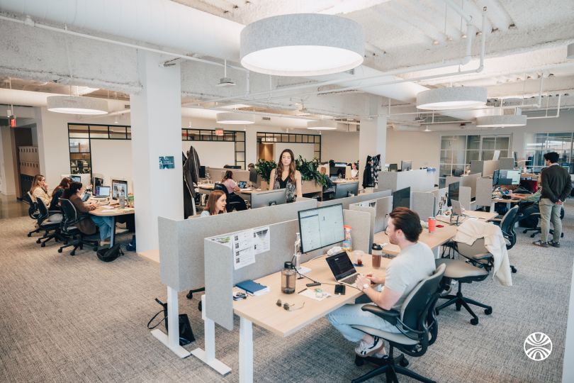 Mirakl team members working at their desks in the company’s office