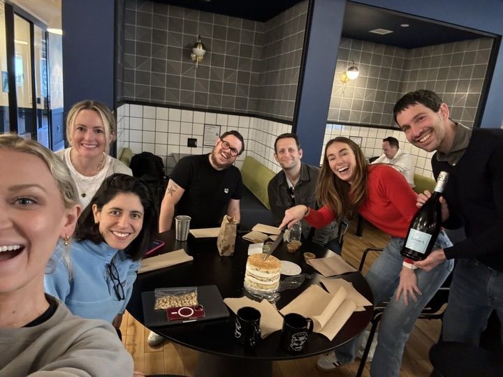 Monte Carlo employees post for a selfie as they celebrate with cake and prosecco.