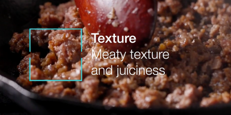 A screenshot of Motif Foodworks' website showing their synthetic ground beef product cooking in a pan.