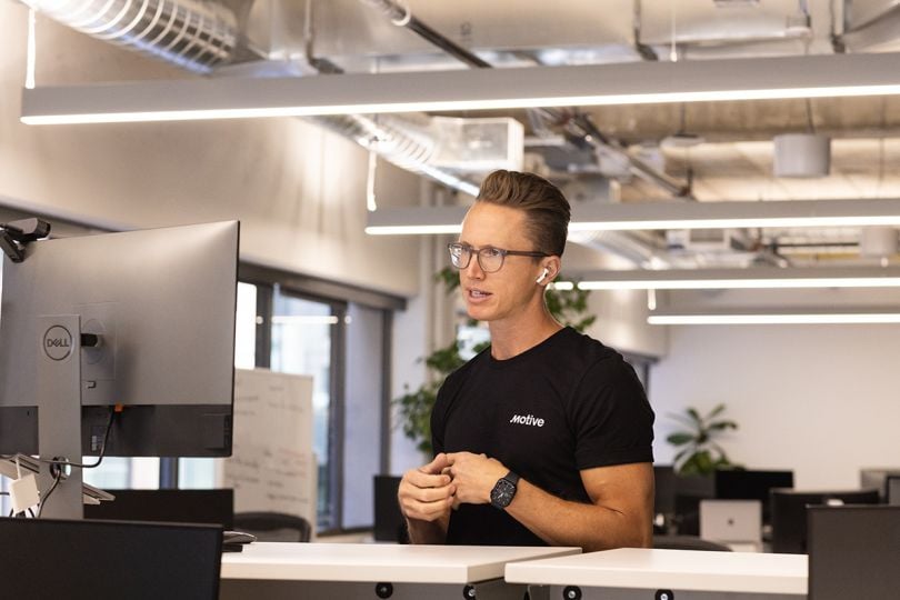 Motive team member working on a computer in the office