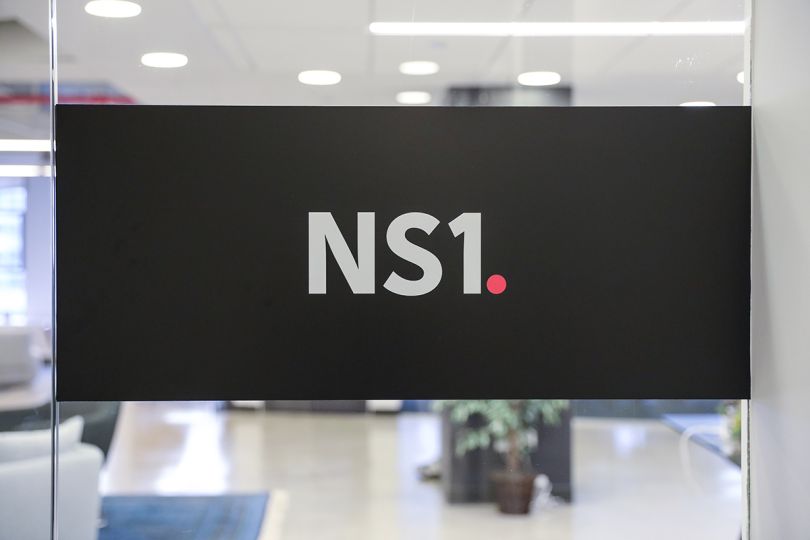 NS1 logo on a monitor in the office