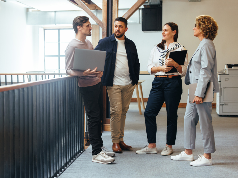 A small team holding a standup meeting