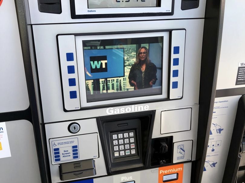 A fuel pump display screen, streaming content from GSTV.