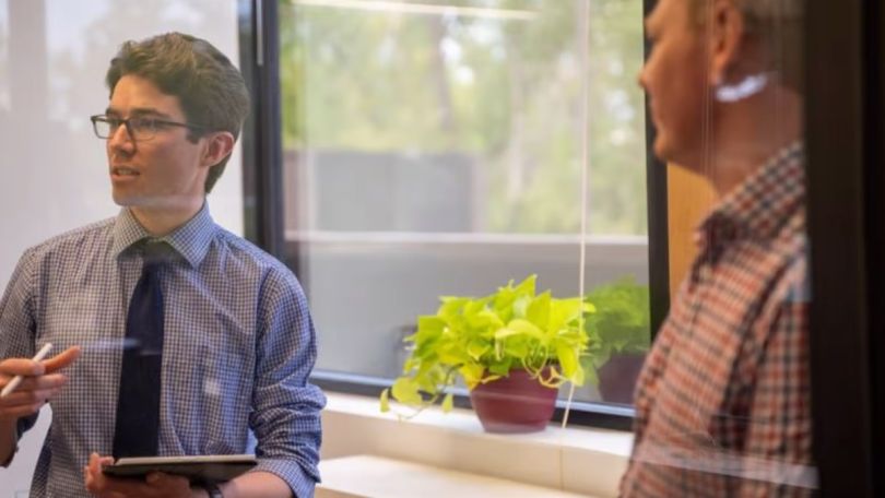 Neat Loans loan officer talking with a homebuyer