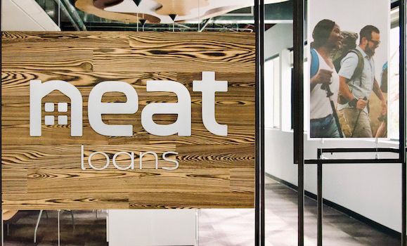 Neat Loans Logo in office