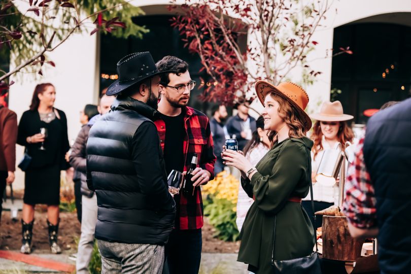 OTA Insight team members chat at an outdoor event in Vail