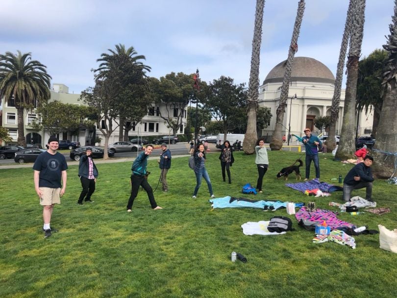 Ontra team members hanging out together at a park