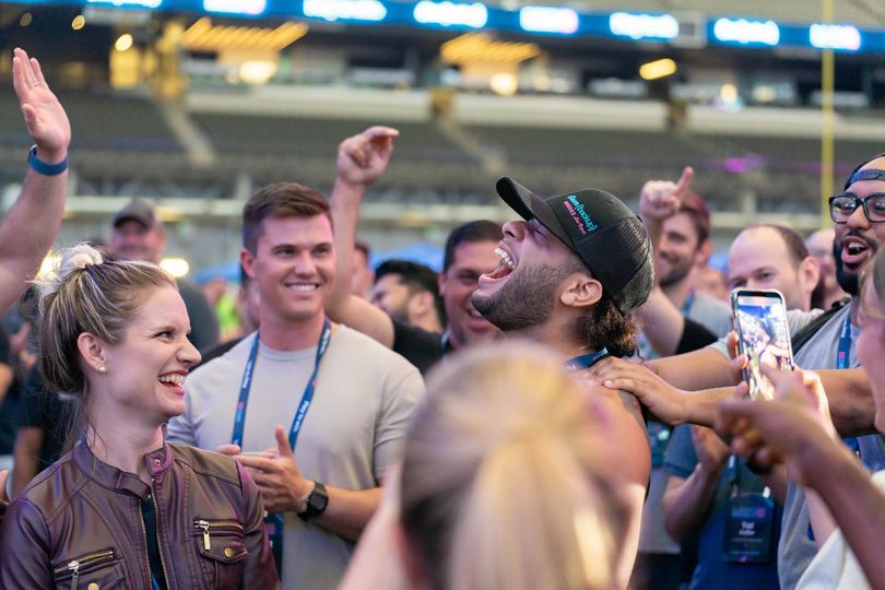 OwnBackup team members smiling and laughing at a sporting event