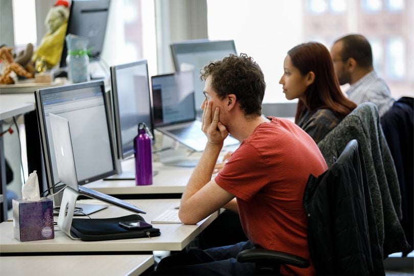 Panorama employees work at their computers