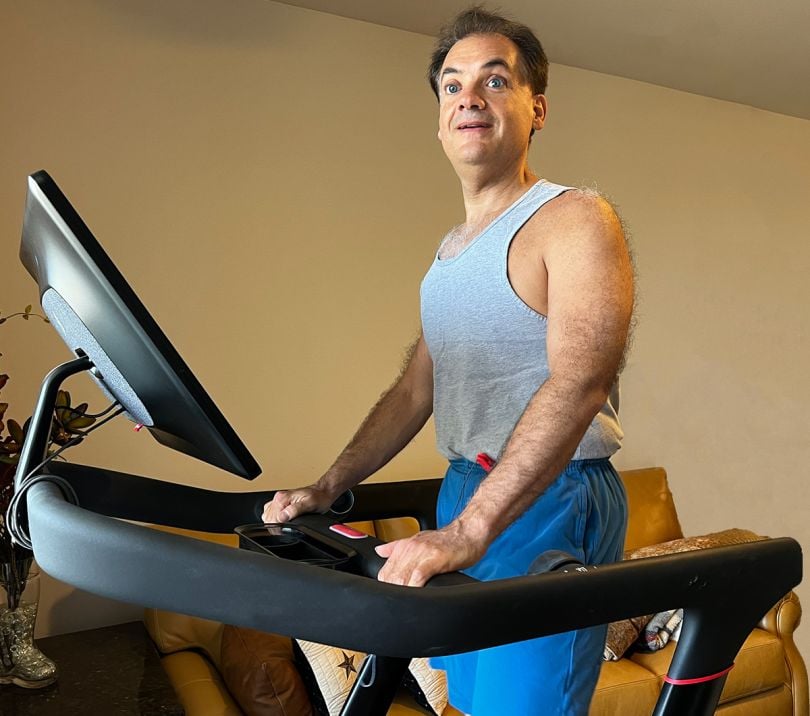 Patrick Sturdavance standing on a Peloton treadmill