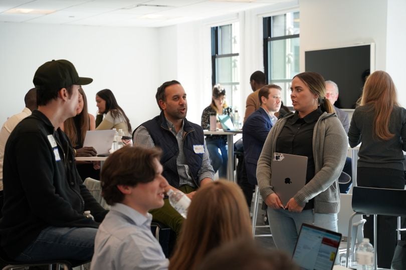 Members of the Expert Institute team collaborating in the office