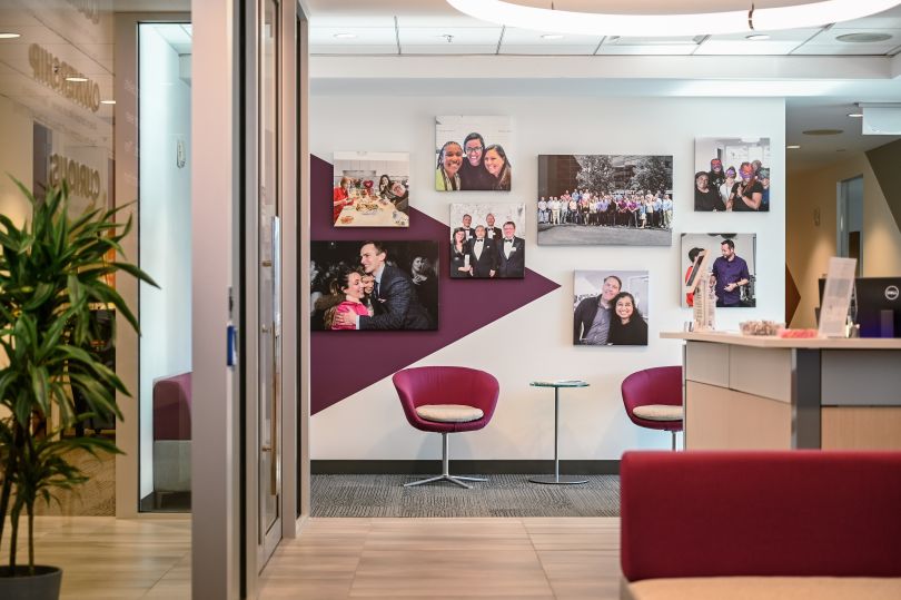 A conference room displaying team photos in the Reibus offices