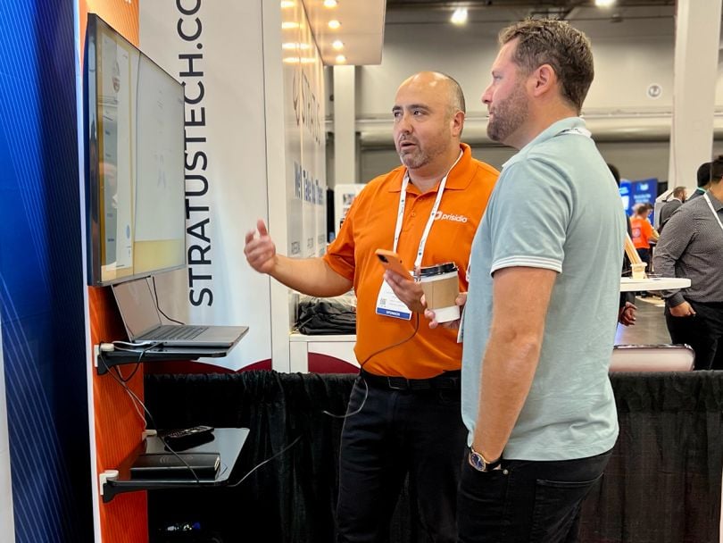 Prisidio team member talking to a potential customer at an expo