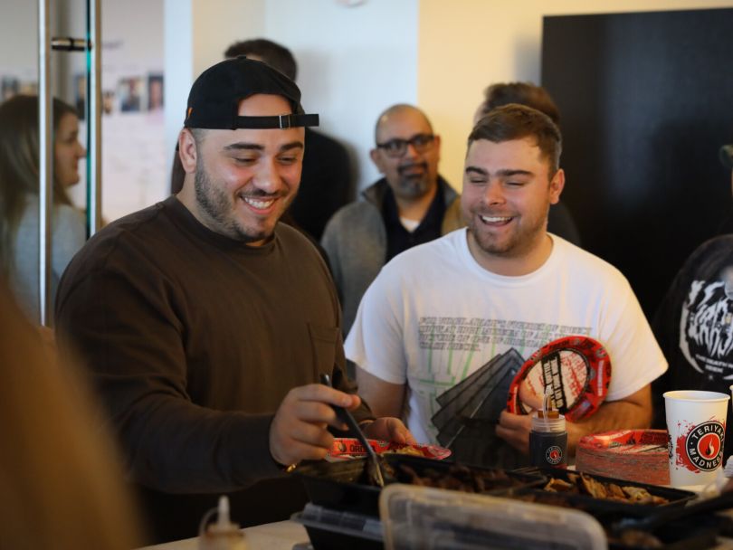  PrizePicks team members enjoying catered lunch together 