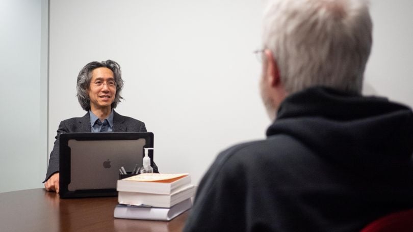 A photo of a Prosodica employee in a meeting