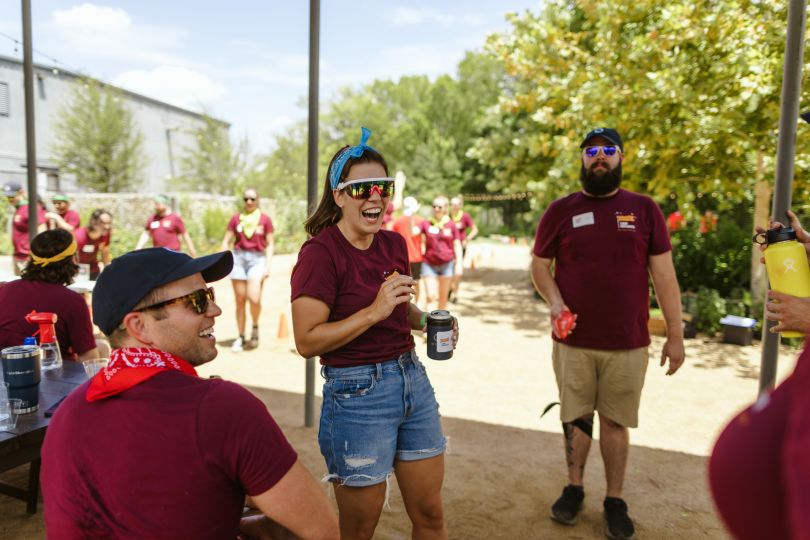 QuotaPath team members smiling talking