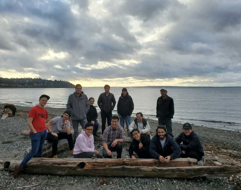 Qulatrics coworkers at a lake