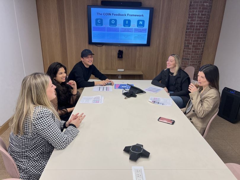 A group of Rent the Runway employees during a meeting.