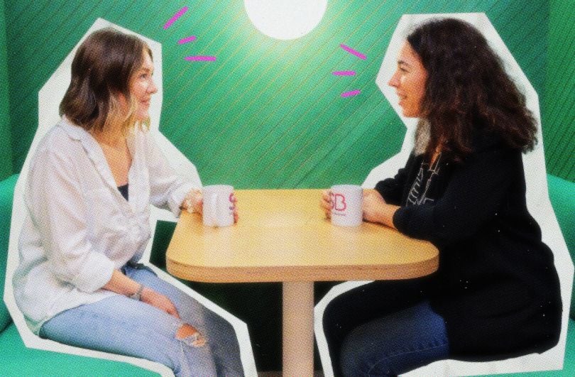 Simply Business team members having coffee together in office lounge area