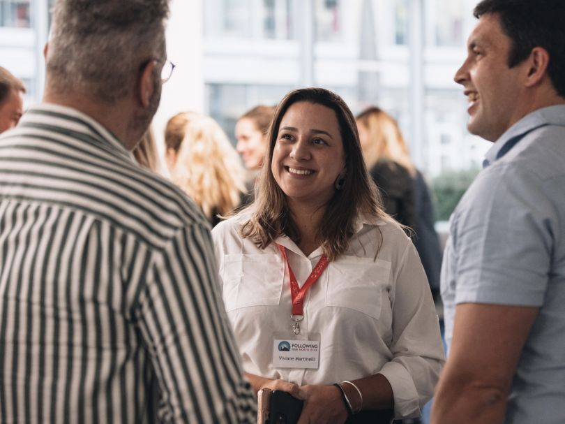 SOPHiA GENETICS employees smile and chat casually.