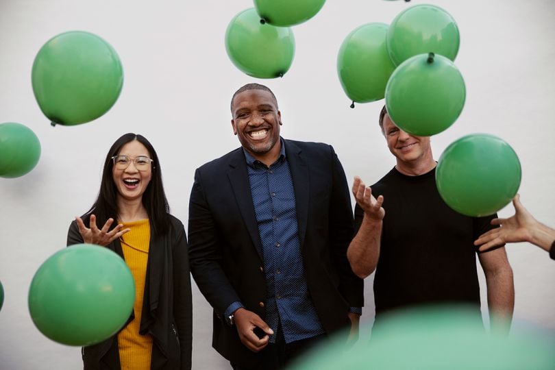 ServiceNow team members with balloons raining down