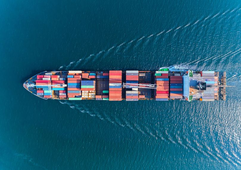 Aerial view of a container ship in the water