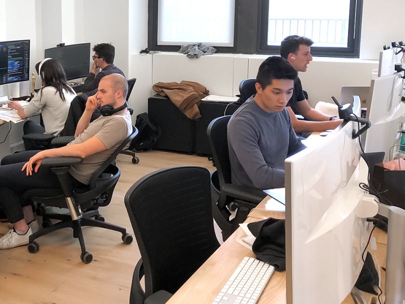 SIMON team members working in the office