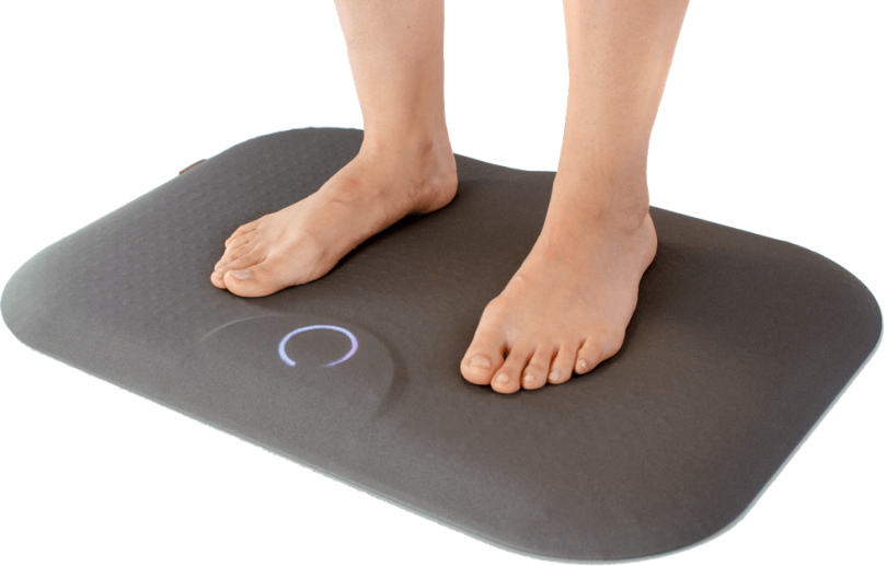 An image of a customer standing on the Podimetrics Smart Mat.