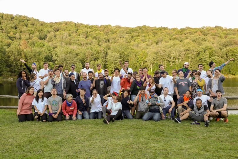 The Stride Consulting team poses for a silly photo outside