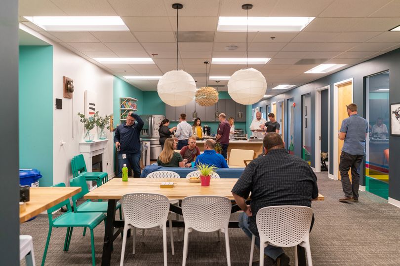 Swimlane team members in the office kitchen area