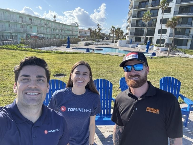 Topline Pro founders Nick Ornitz and Shannon Kay pose for a selfie with one of the company’s customers