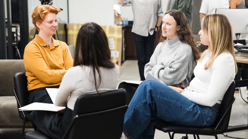 A group of TravelPerk employees chat in a group.