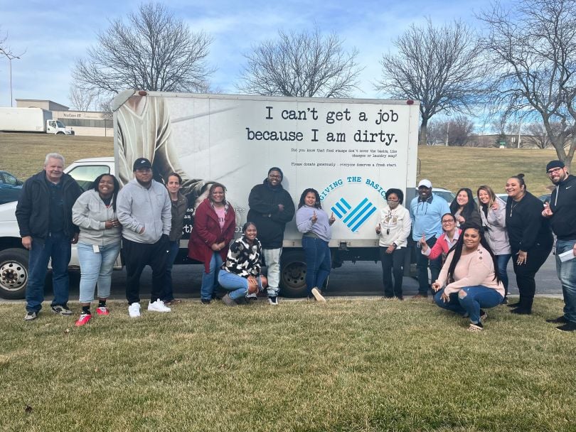 TrueML team members volunteering at Giving the Basics in Kansas City.