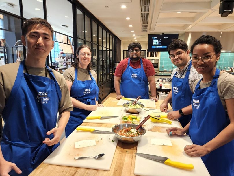 Validere team members at a cooking class