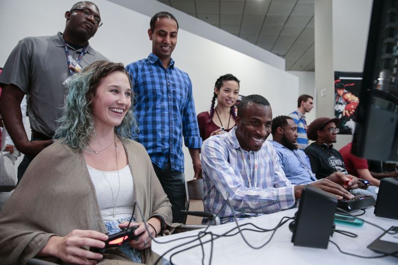 Warner Bros. Discovery team members playing video games together