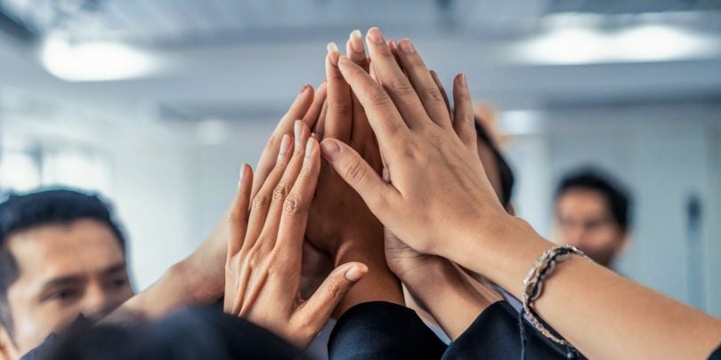 coworkers giving high fives