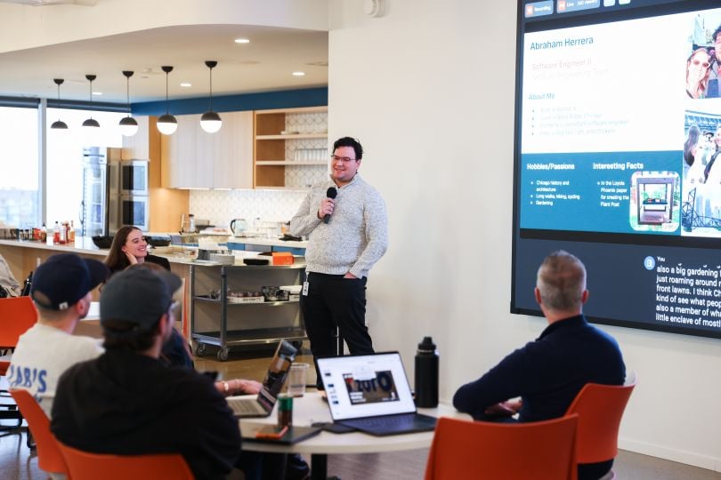 Zoro team member gives presentation in front of several colleagues during the company's Hard Hat event