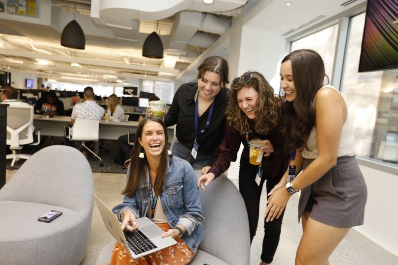 Tegus team members share a laugh in the company's offices