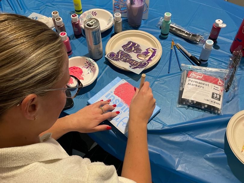 The team enjoyed painting inspirational canvases for a local women's shelter at an event organized by the Women at BigTime ERG.