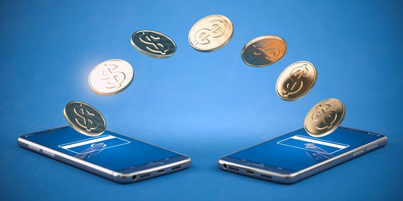 two smart phones exchanging digital coins