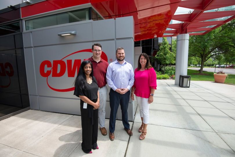 CDW employees standing outside by office entrance