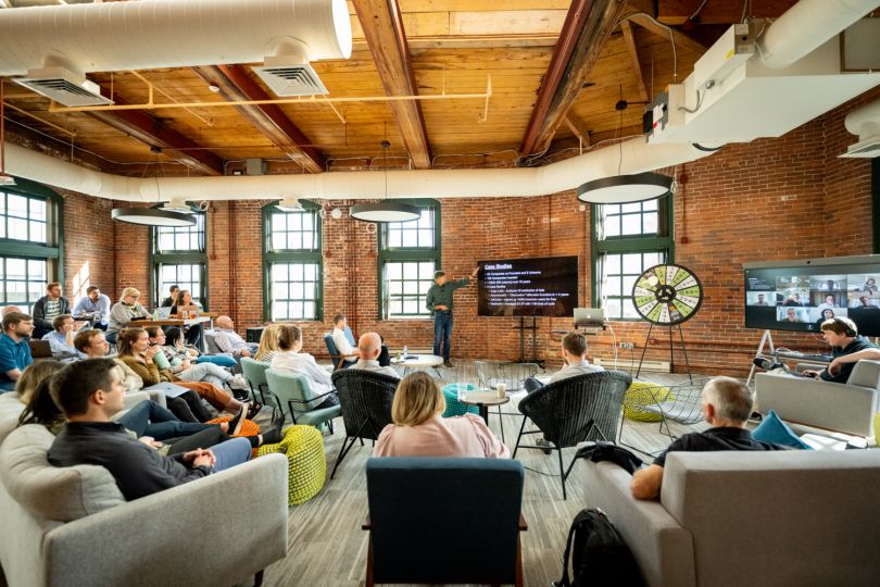 Cogo Labs team gathered in office for meeting