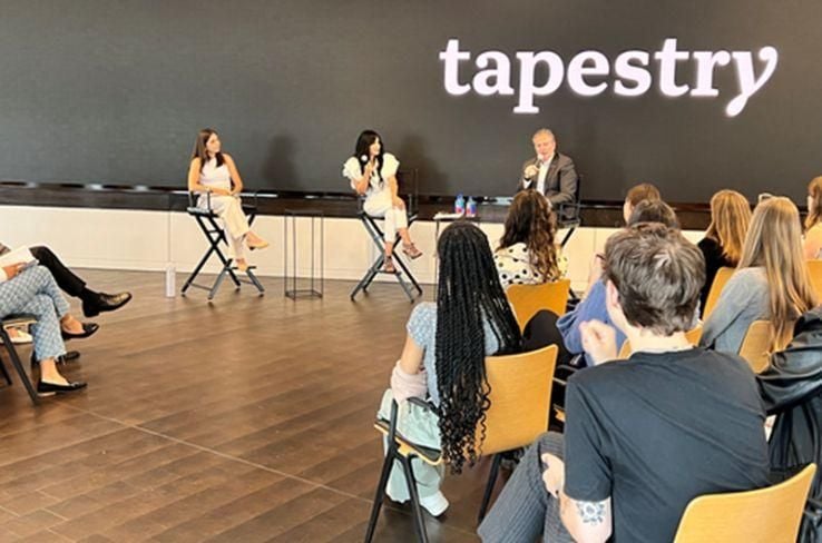 A fireside chat with Tapestry leaders in front of a group of interns.