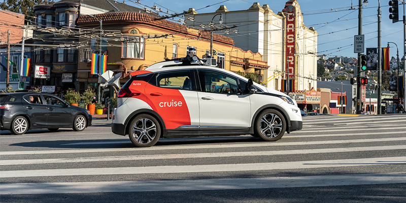 The Cruise IoT vehicle driving through a city.